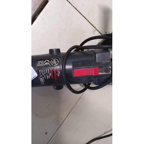 34 - 600W electric angle grinder, black with red switch, complete with side handle and power cord.