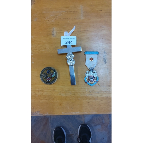 344 - Set of three items: a military challenge coin, a cross with emblem, and a 