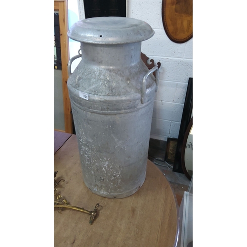 351 - Vintage milk churn with lid, featuring dual side handles and a rustic patina finish.