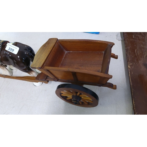 399 - Handcrafted wooden cart with ceramic horse figurine. The horse is harnessed in detailed tack with me... 