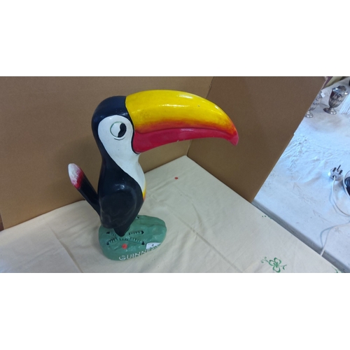 4 - Guinness toucan figurine, painted plaster. Features the iconic bird with a vibrant yellow, red, and ... 