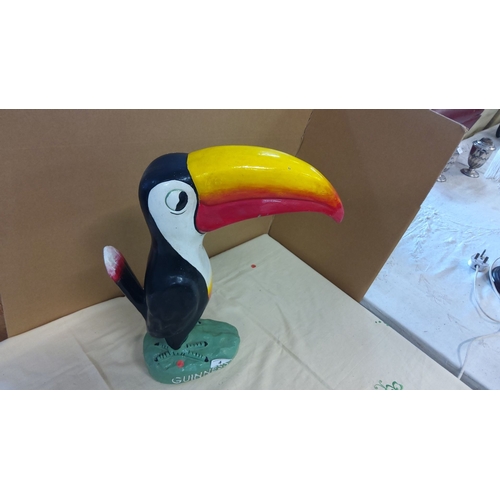 4 - Guinness toucan figurine, painted plaster. Features the iconic bird with a vibrant yellow, red, and ... 
