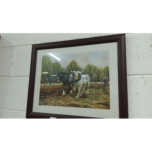 401 - Framed print featuring two horses plowing a field. The painting is signed by the artist and set in a... 