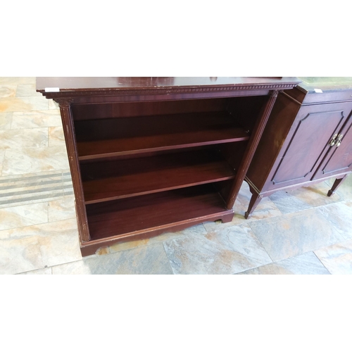 404 - Mahogany open-front bookshelf with decorative top molding and paneled sides. Three adjustable shelve... 