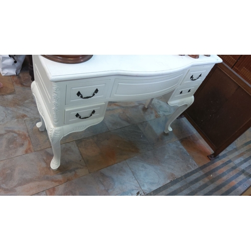 414 - White-painted antique-style dressing table with five drawers. The table features ornate carvings on ... 