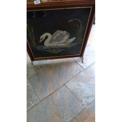 417 - Vintage firescreen depicting a swan on a pond, surrounded by reeds. Set within a wooden frame with b... 