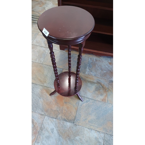 418 - Mahogany plant stand with twisted legs and round top. Modern design.