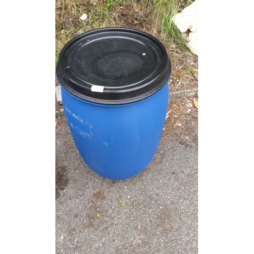 430 - Blue plastic barrel with black lid.