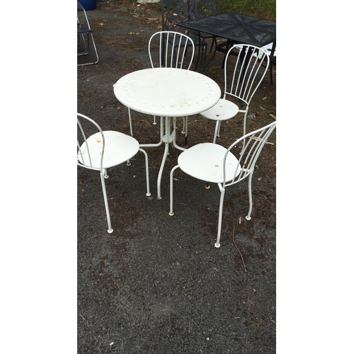 435 - Modern outdoor bistro set. Includes a round metal table and four matching chairs, all in a white fin... 