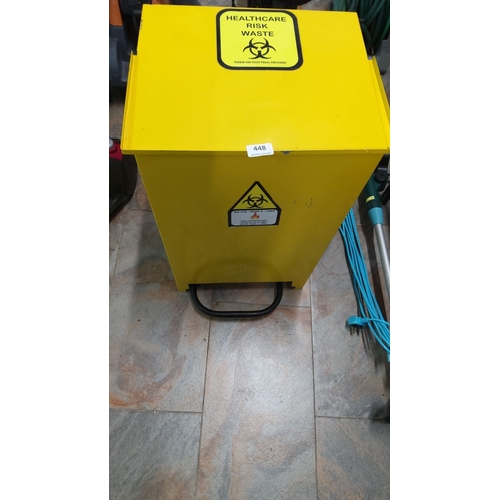 448 - Yellow healthcare risk waste bin with biohazard symbols. It is pedal-operated and has a sturdy const... 