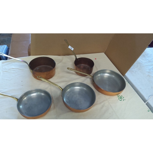 46 - Set of 5 copper saucepans and frying pans with brass handles.