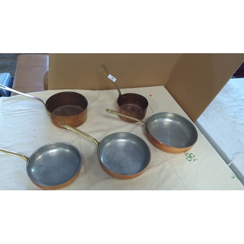 46 - Set of 5 copper saucepans and frying pans with brass handles.