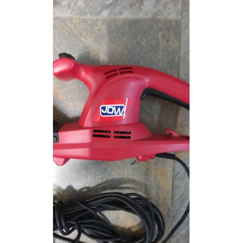 461 - JDW electric hedge trimmer in red, with a robust blade and a long power cord.