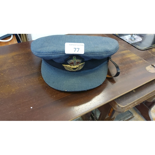 77 - Vintage blue RAF officer's peaked cap featuring embroidered insignia with crown and eagle, black lea... 