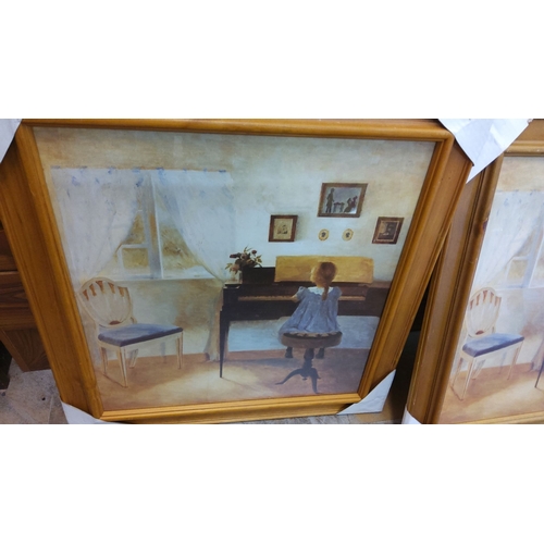 83 - Pair of framed paintings depicting a girl playing the piano in an interior setting. Each painting fe... 