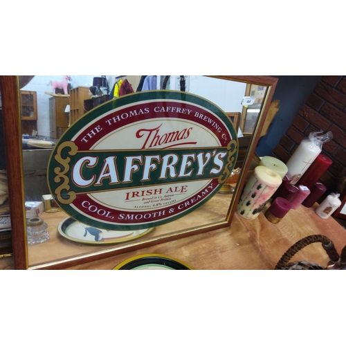 88 - Vintage Thomas Caffrey's Irish Ale mirror sign. It showcases classic pub advertising with a framed w... 