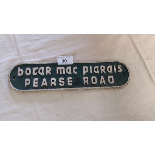 30 - Vintage Pearse Road street sign made of metal with embossed lettering. The sign has a classic green ... 