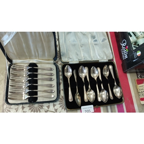 205 - Boxed cutlery sets with livered branding,each with fine detailing.