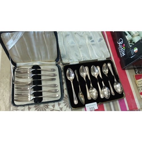 205 - Boxed cutlery sets with livered branding,each with fine detailing.