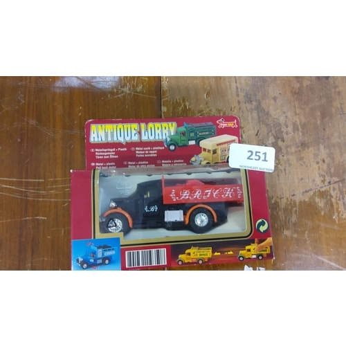 251 - Antique Lorry - Die-cast metal and plastic model featuring a classic truck design in original packag... 