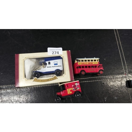 274 - Mixed lot of three model vehicles. Includes an Oxford Die-Cast boxed 