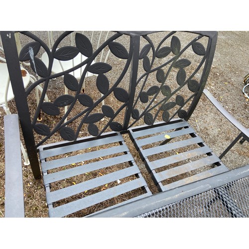 434 - Outdoor wrought iron patio set featuring a square mesh top table and two chairs & bench with leaf mo... 