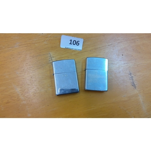 106 - Pair of vintage Zippo lighters, engraved with initials 