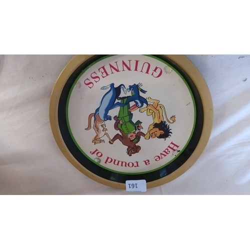 161 - Vintage 1950s Guinness round serving tray featuring colorful animal characters and 