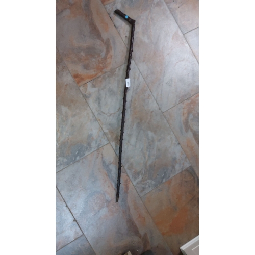 102 - Antique wooden walking stick with natural finish and carved details. Length approximately 90 cm. Lik... 