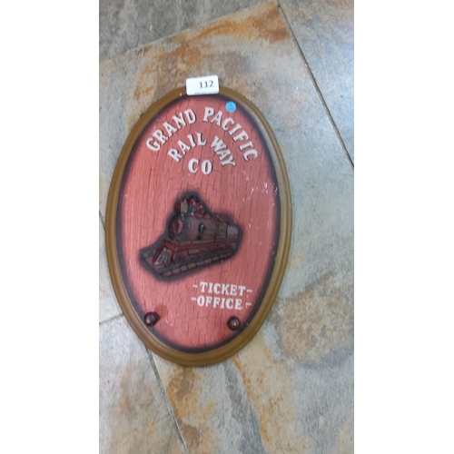 112 - Oval plaque featuring 