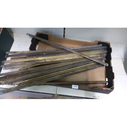 129 - Box of assorted brass rods and bars, various shapes and sizes.