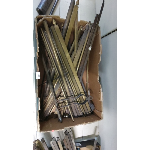 130 - Box of mixed metal rods, predominantly brass. Various lengths and designs.