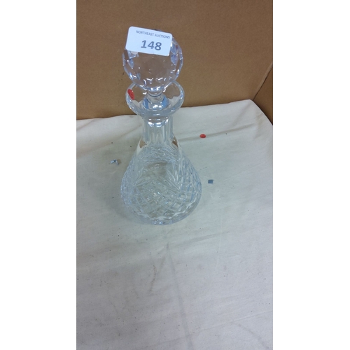 148 - Intricately cut Tyrone crystal decanter with a faceted stopper, showcasing elegant craftsmanship and... 