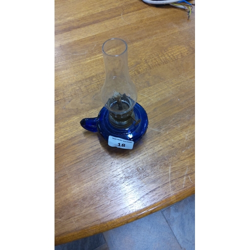 18 - Vintage blue glass oil lamp with clear glass chimney and metal burner. Stands approximately 10 inche... 