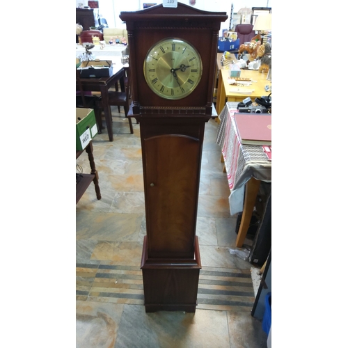 189 - Antique mahogany longcase clock featuring a brass dial with Roman numerals and intricate woodwork de... 