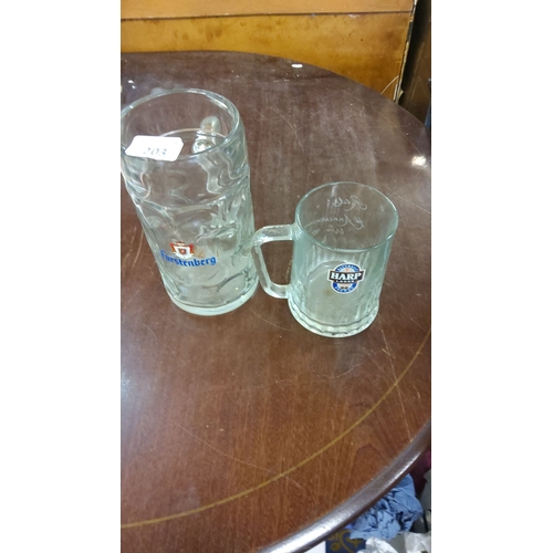 203 - Pair of branded beer mugs: one large Fürstenberg stein and one small Harp Lager glass. Clear glass w... 