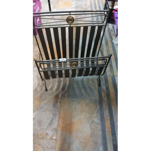 209 - Vintage wrought iron magazine rack with brass accents. Features vertical slats and decorative detail... 