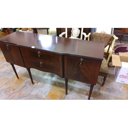 228 - Mahogany sideboard with two central drawers and two cabinets. Features brass hardware and fluted leg... 