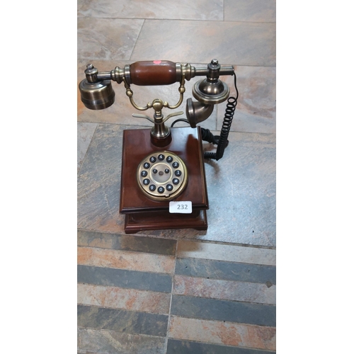 232 - Vintage-inspired rotary dial telephone with brass and wood accents.