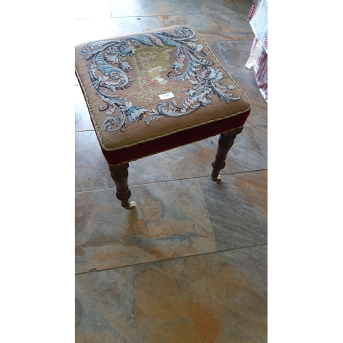 250 - Victorian embroidered footstool with intricate floral and landscape motifs. Features turned wooden l... 