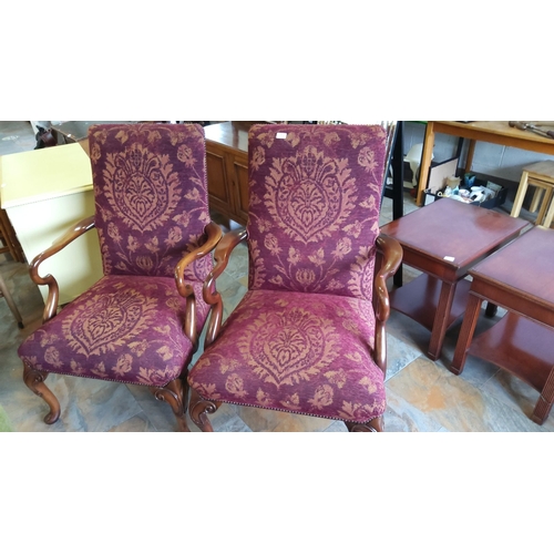 257 - Pair of armchairs with carved wooden frames and purple damask upholstery.