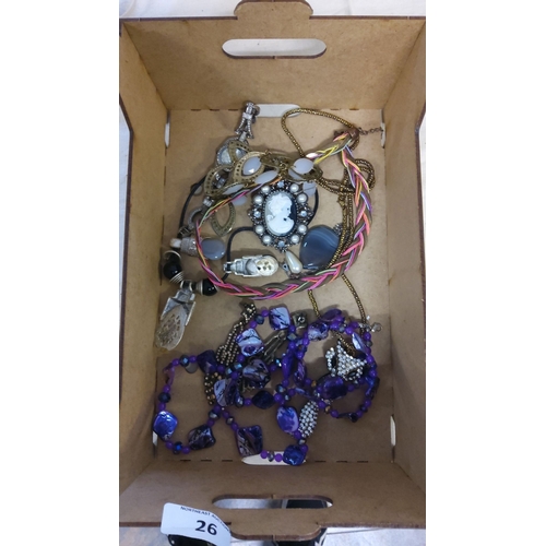 26 - Mixed vintage costume jewelry lot. The collection includes various necklaces, some adorned with purp... 