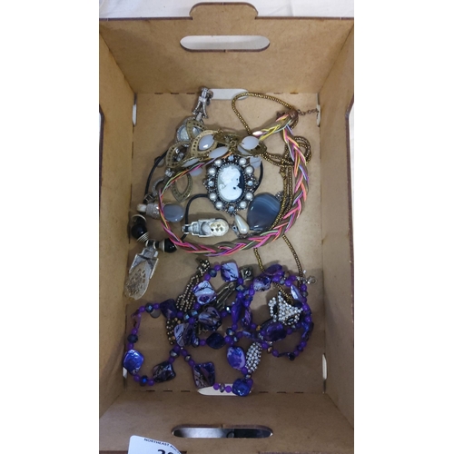 26 - Mixed vintage costume jewelry lot. The collection includes various necklaces, some adorned with purp... 