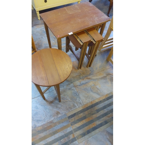 262 - Set of wooden tables and stools. Includes an expandable rectangular drop-leaf table with matching ne... 