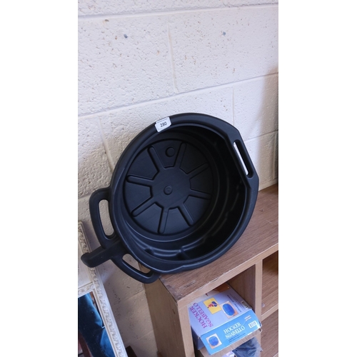 280 - Black plastic oil drain pan with integrated handles.