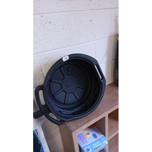 280 - Black plastic oil drain pan with integrated handles.