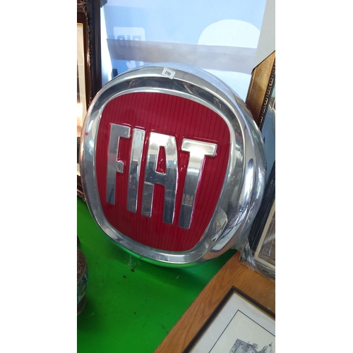 290 - Fiat sign, featuring bold red background and silver lettering within a plastic frame.