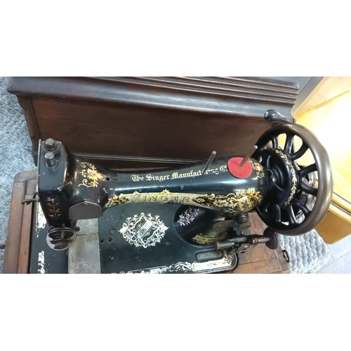 300 - Antique Singer hand-crank sewing machine with ornate gold floral detailing and wooden cover. Early 2... 