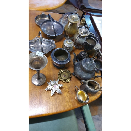 314 - Assorted vintage silver plate. Includes teapots, trays, bowls, vases, and ornamental pieces. Predomi... 