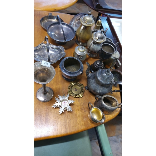 314 - Assorted vintage silver plate. Includes teapots, trays, bowls, vases, and ornamental pieces. Predomi... 